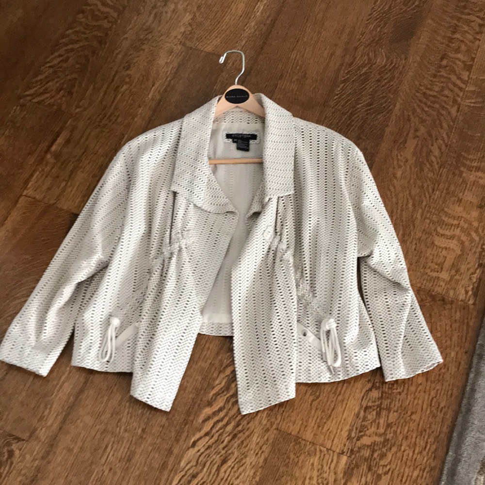 Etcetera off white perforated leather jacket.